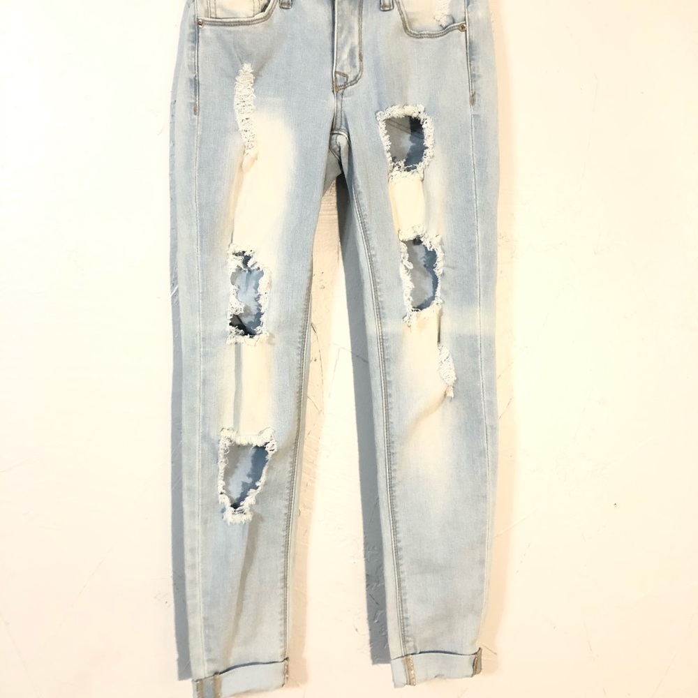Light wash jeans with holes